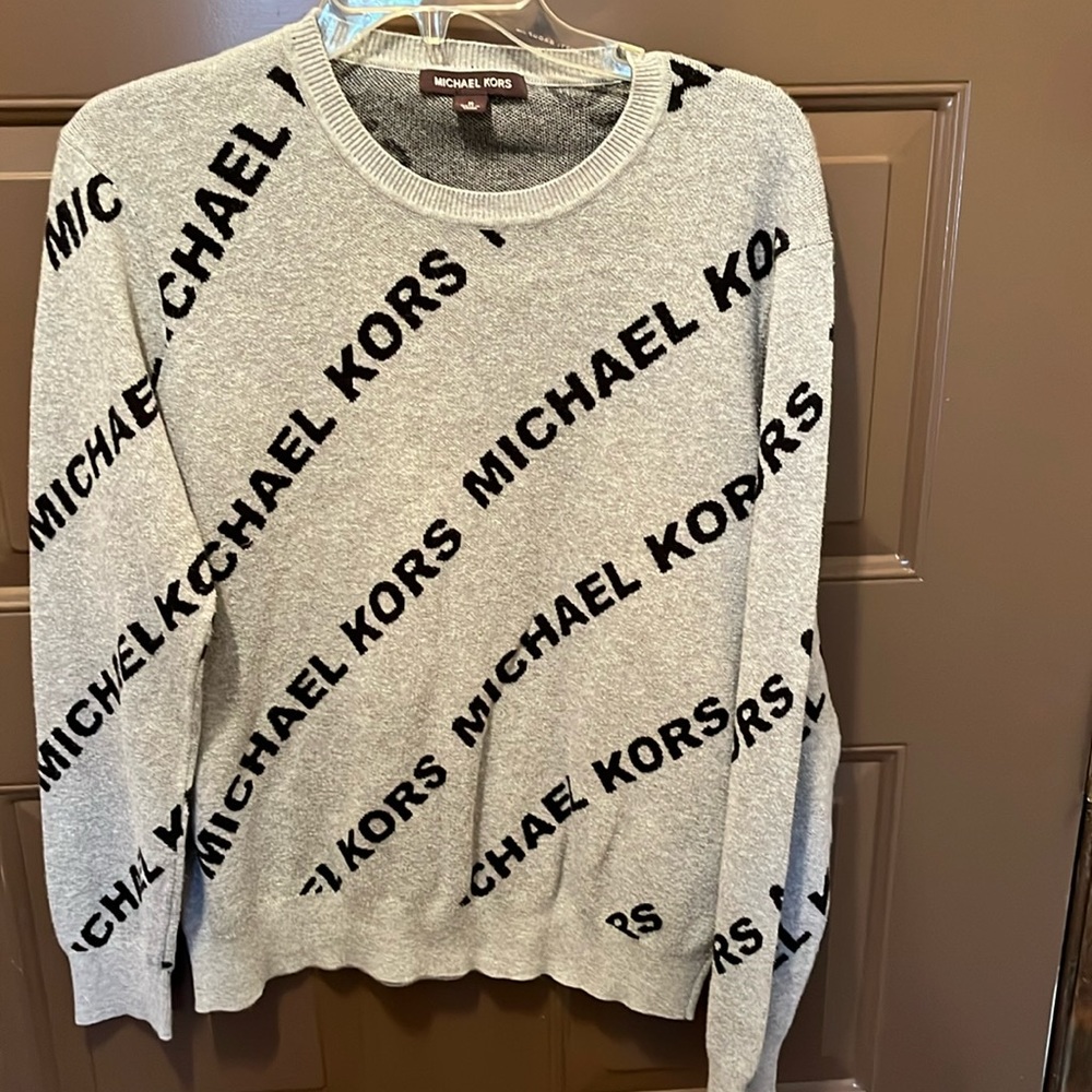 Good used condition Micharl Kors men’s sweater. Size medium.